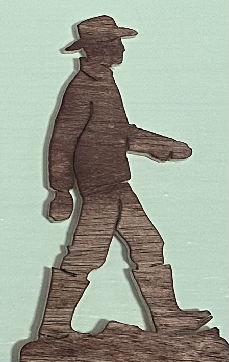 Scroll-saw silhouette of a man
